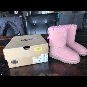 Pink UGG boots with bows